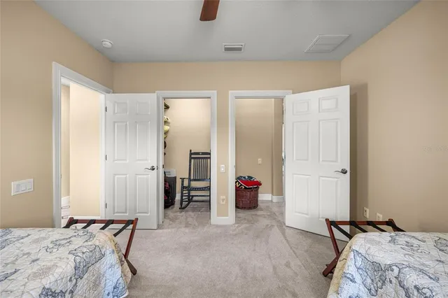 a bedroom with a bed and a couch