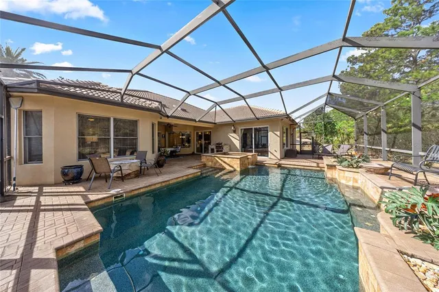 a view of a swimming pool with a patio