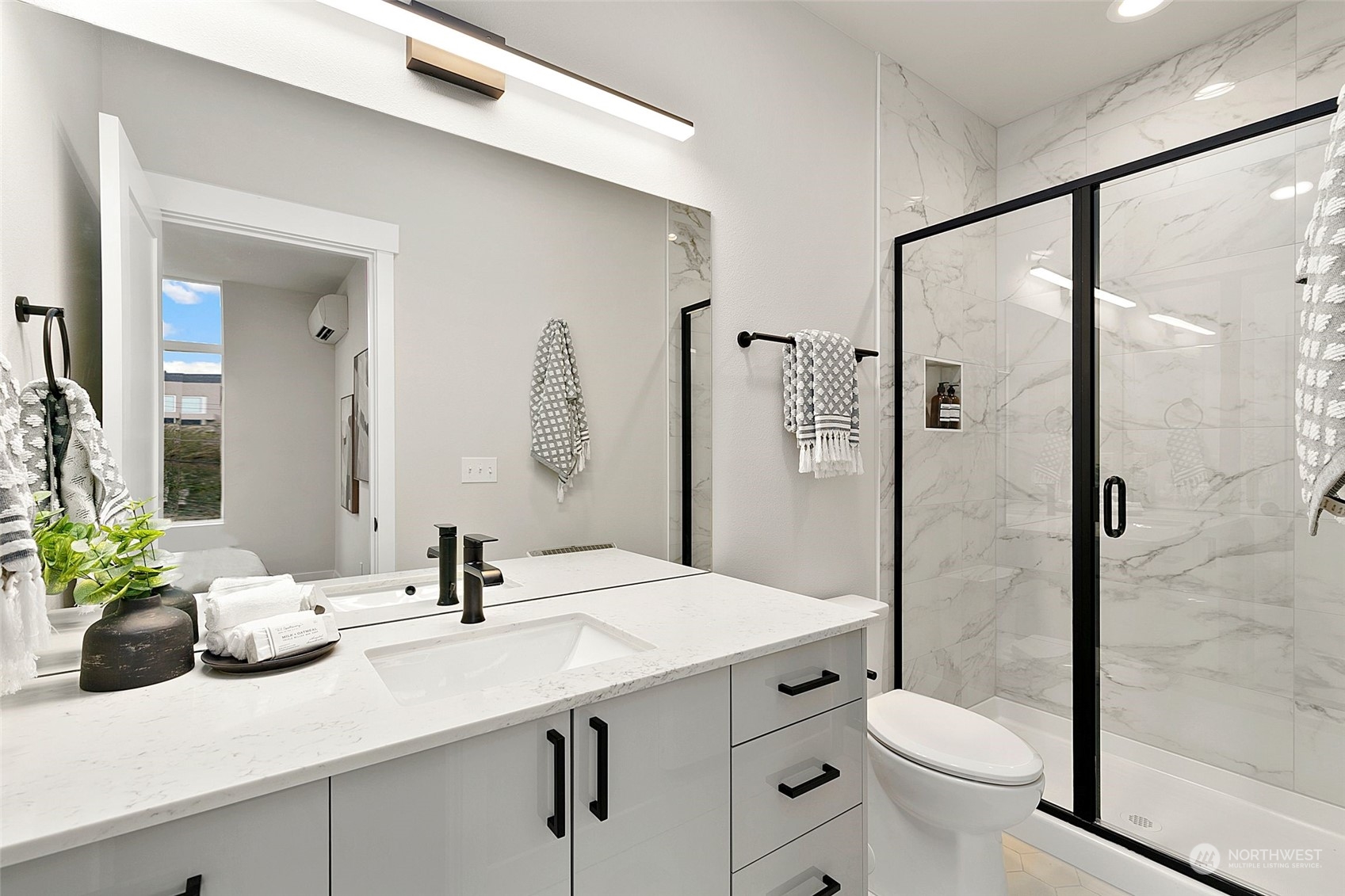 1609 South Washington Street Seattle, WA 98144 - Photo 12 of 14 a bathroom with a sink toilet a mirror and shower