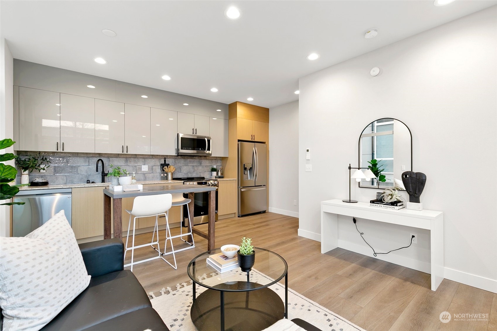 1609 South Washington Street Seattle, WA 98144 - Photo 5 of 14 a living room with stainless steel appliances kitchen island granite countertop furniture a rug kitchen view and a sink