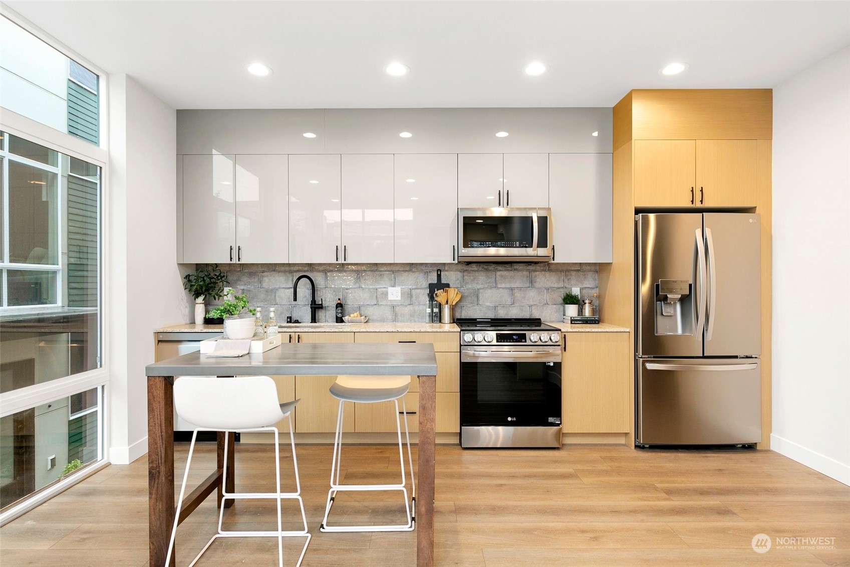 1609 South Washington Street Seattle, WA 98144 - Photo 8 of 14 a kitchen with stainless steel appliances granite countertop a stove a sink a refrigerator and a microwave