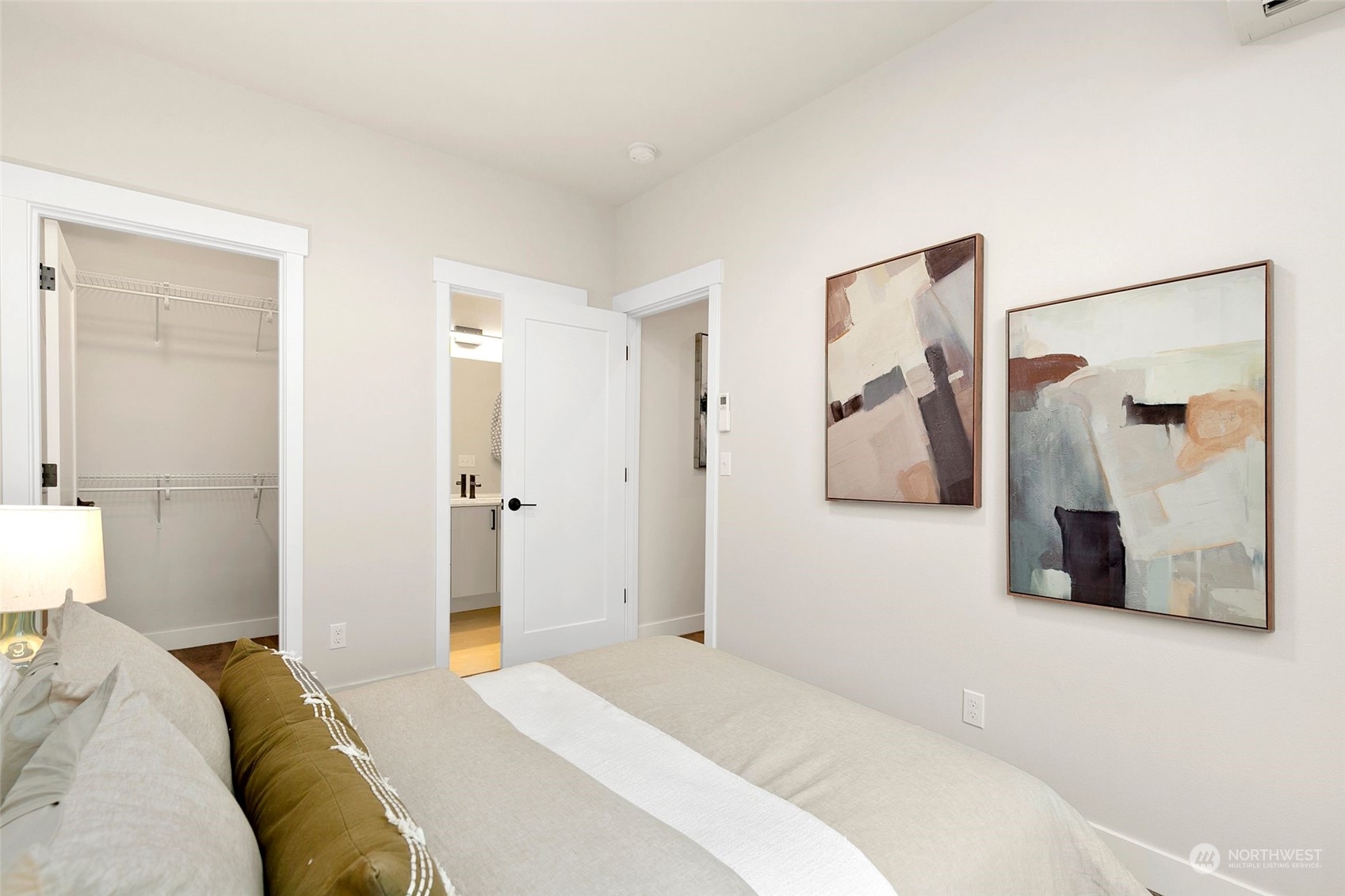 1609 South Washington Street Seattle, WA 98144 - Photo 10 of 14 a bedroom with a white bed and bathroom