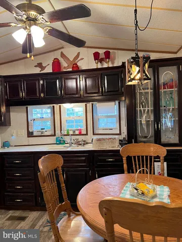 a view of a dining room with furniture and window