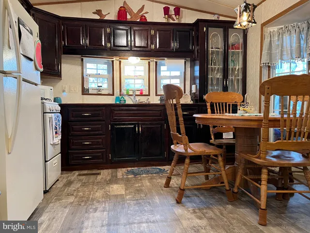 a view of a bedroom with bed and furniture