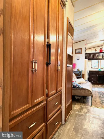 a bedroom with a bed and cabinets