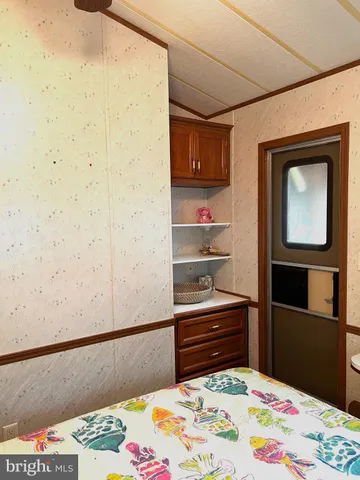 a bathroom with a toilet and a shower curtain