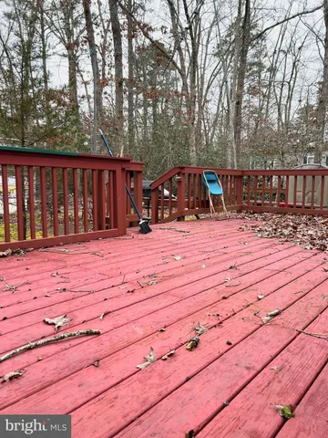 a view of a dinning table and chairs in patio of the house