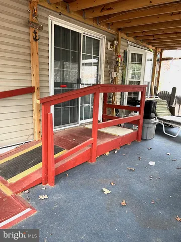 a view of a lake with a yard and covered with green space