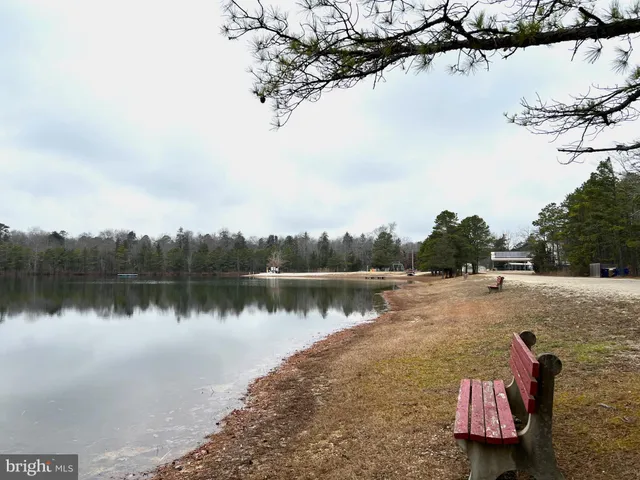 a view of a house with a yard covered with snow