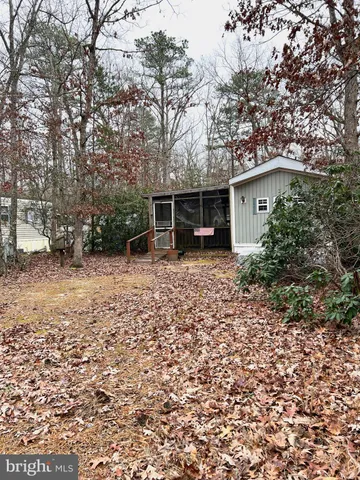 a view of room with window and flat screen tv