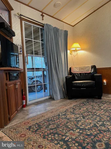 a bedroom with a bed couch and a dresser