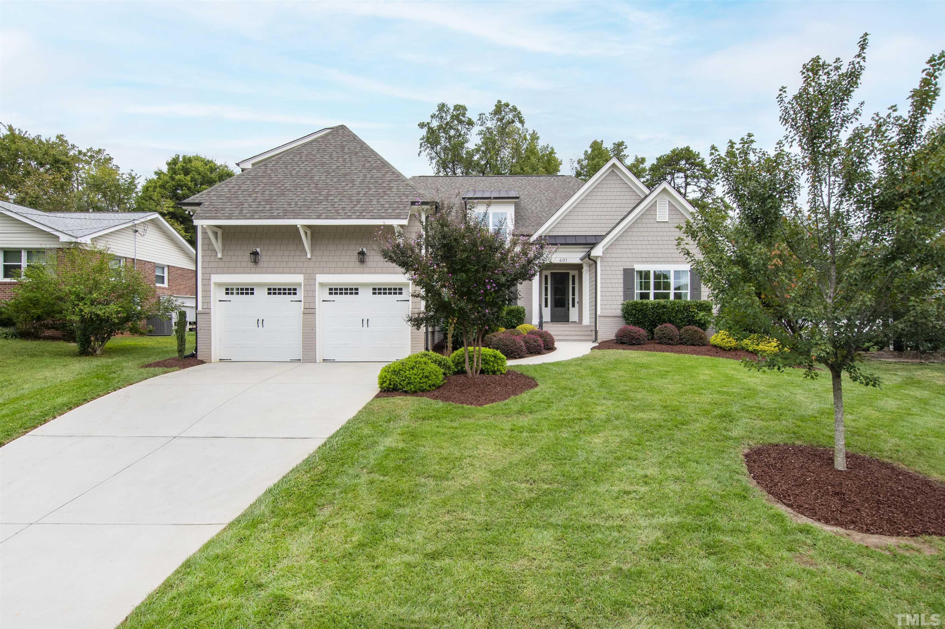401 Latimer Road Raleigh, NC 27609 - Photo 1 of 45 a front view of a house with a yard and garage