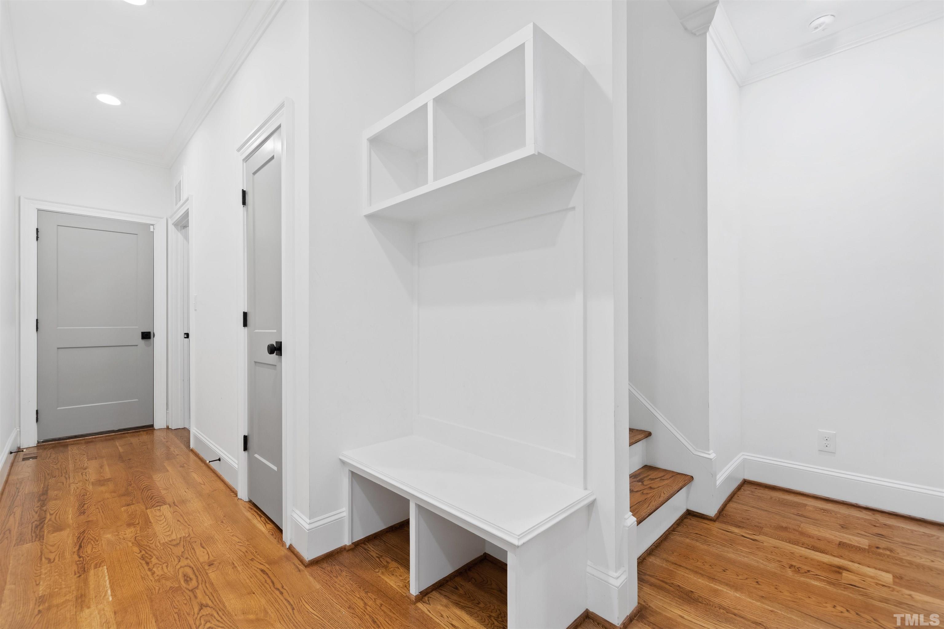 401 Latimer Road Raleigh, NC 27609 - Photo 14 of 45 a view of room with wooden floor and hallway
