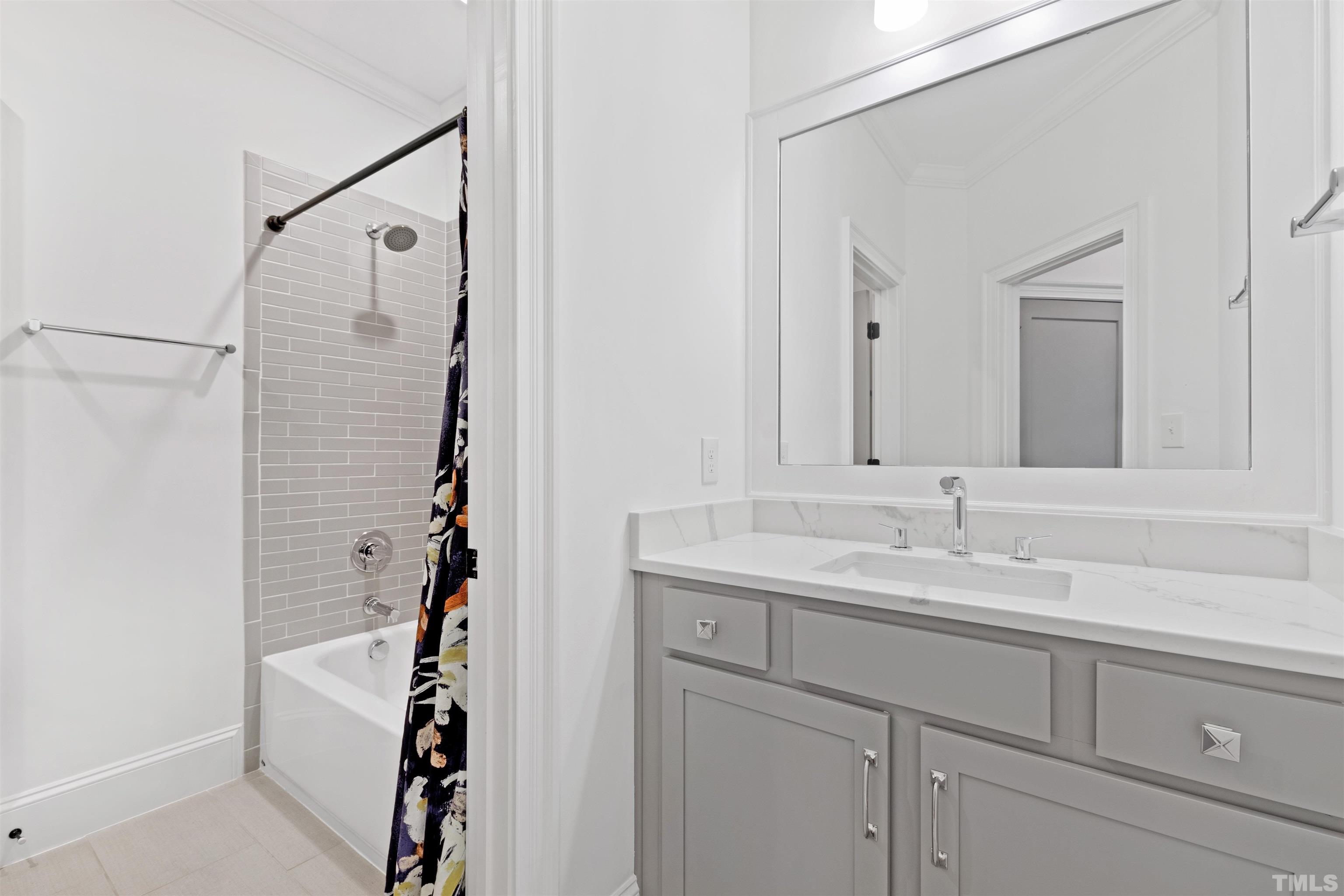 401 Latimer Road Raleigh, NC 27609 - Photo 17 of 45 a bathroom with a sink and a mirror