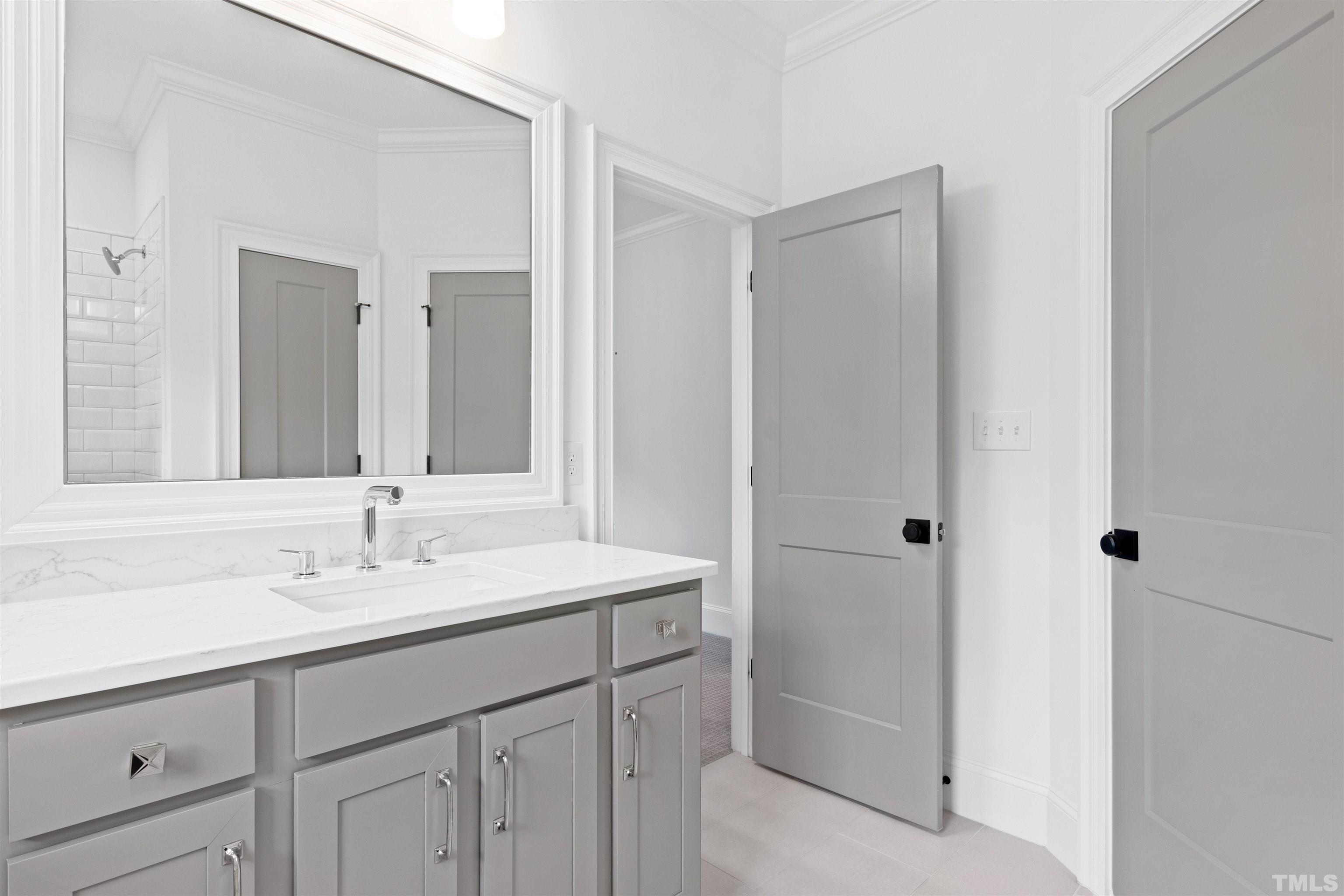401 Latimer Road Raleigh, NC 27609 - Photo 18 of 45 a bathroom with a sink and a mirror