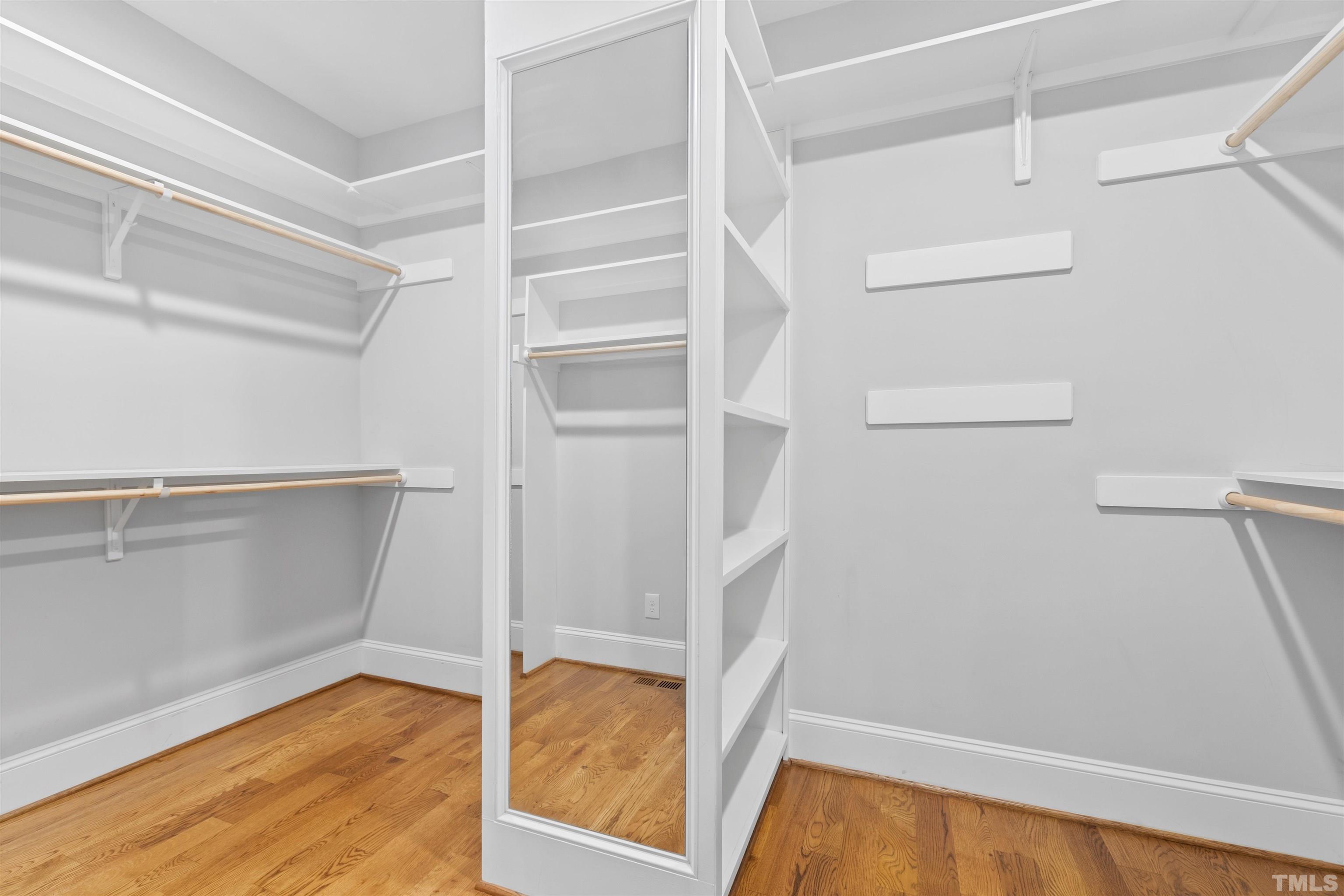 401 Latimer Road Raleigh, NC 27609 - Photo 19 of 45 a view of walk in closet with empty racks