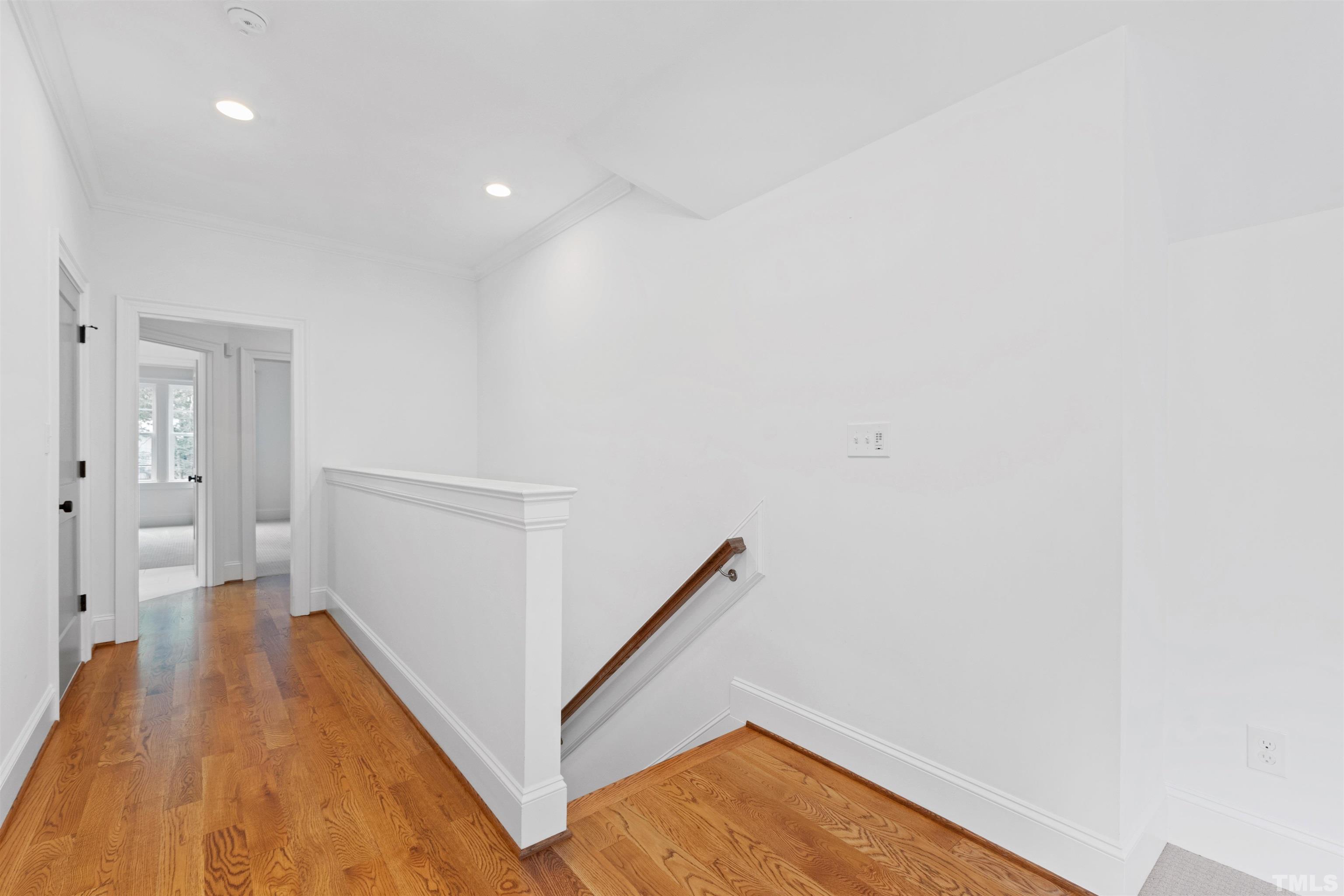 401 Latimer Road Raleigh, NC 27609 - Photo 21 of 45 a view of hallway with wooden floor