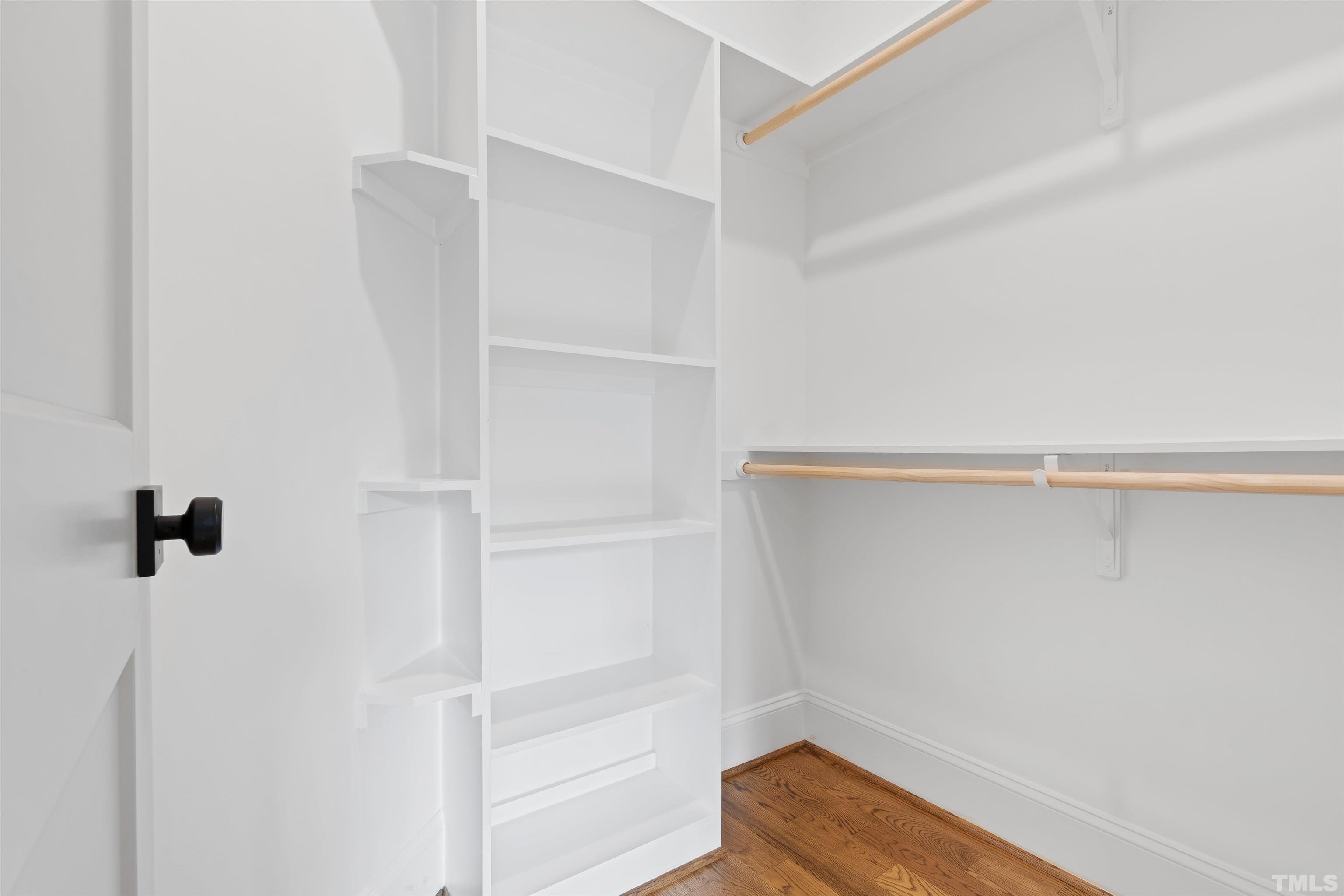401 Latimer Road Raleigh, NC 27609 - Photo 23 of 45 a view of walk in closet with empty racks