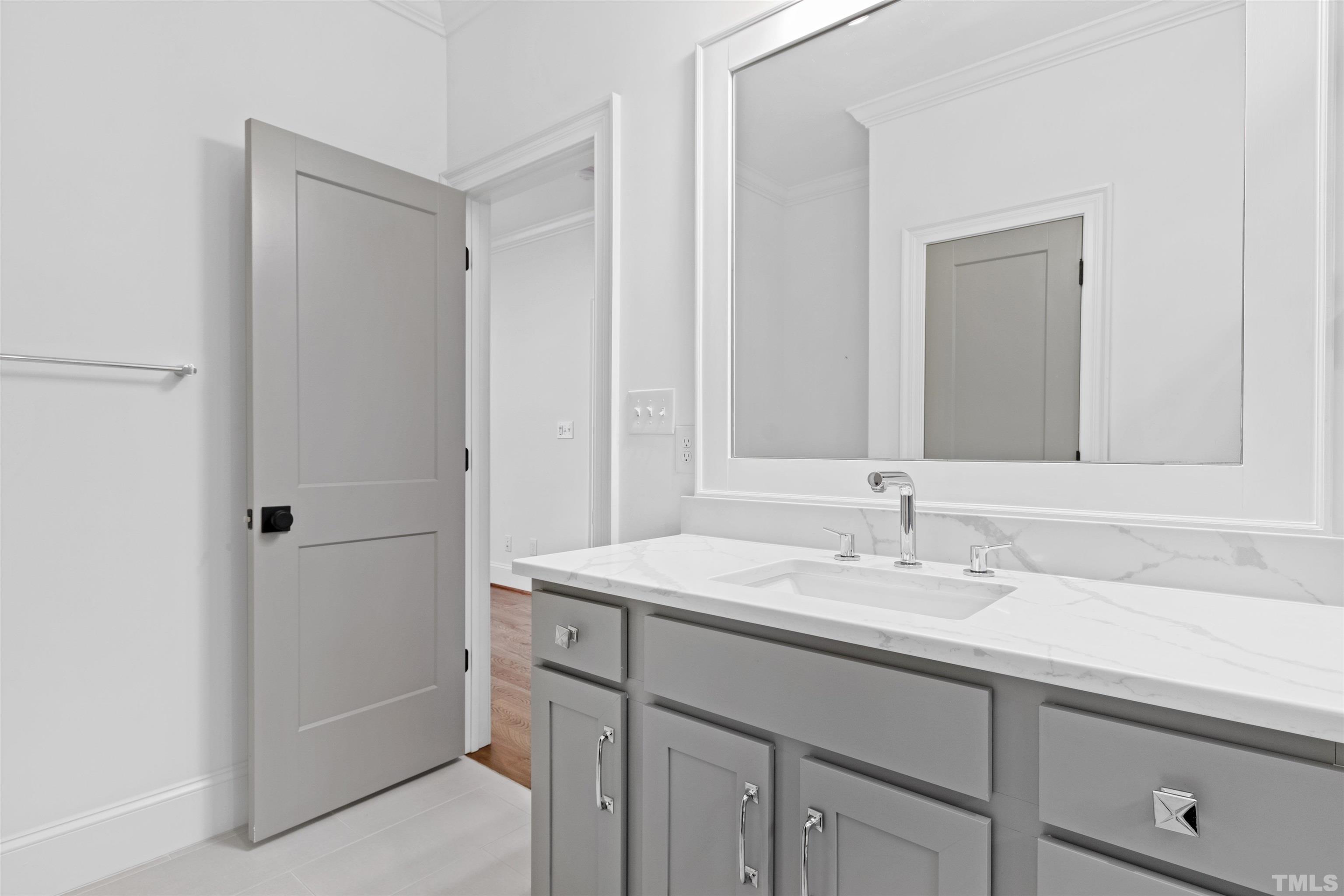 401 Latimer Road Raleigh, NC 27609 - Photo 24 of 45 a bathroom with a sink and a mirror