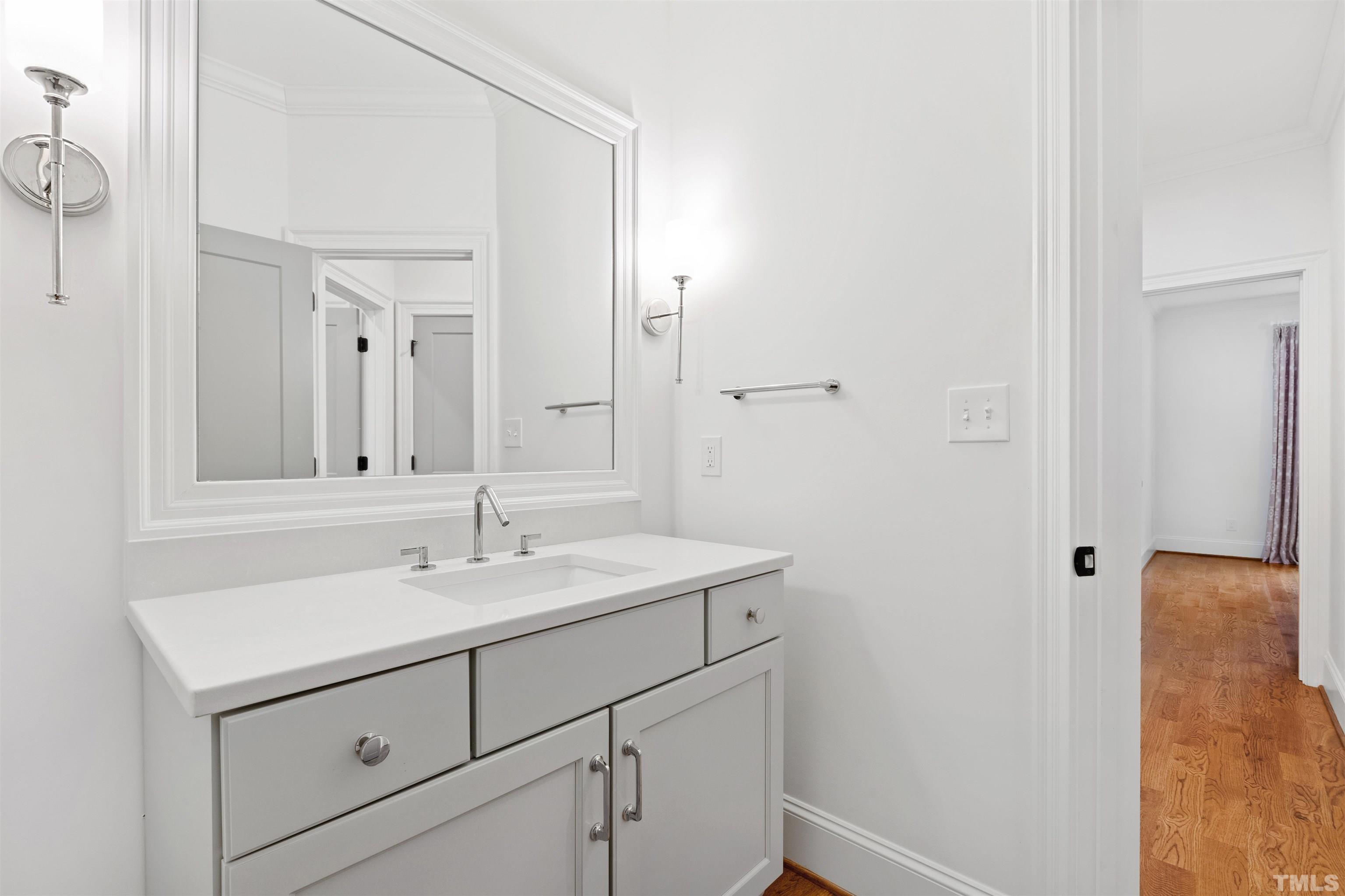 401 Latimer Road Raleigh, NC 27609 - Photo 25 of 45 a bathroom with a sink and a mirror