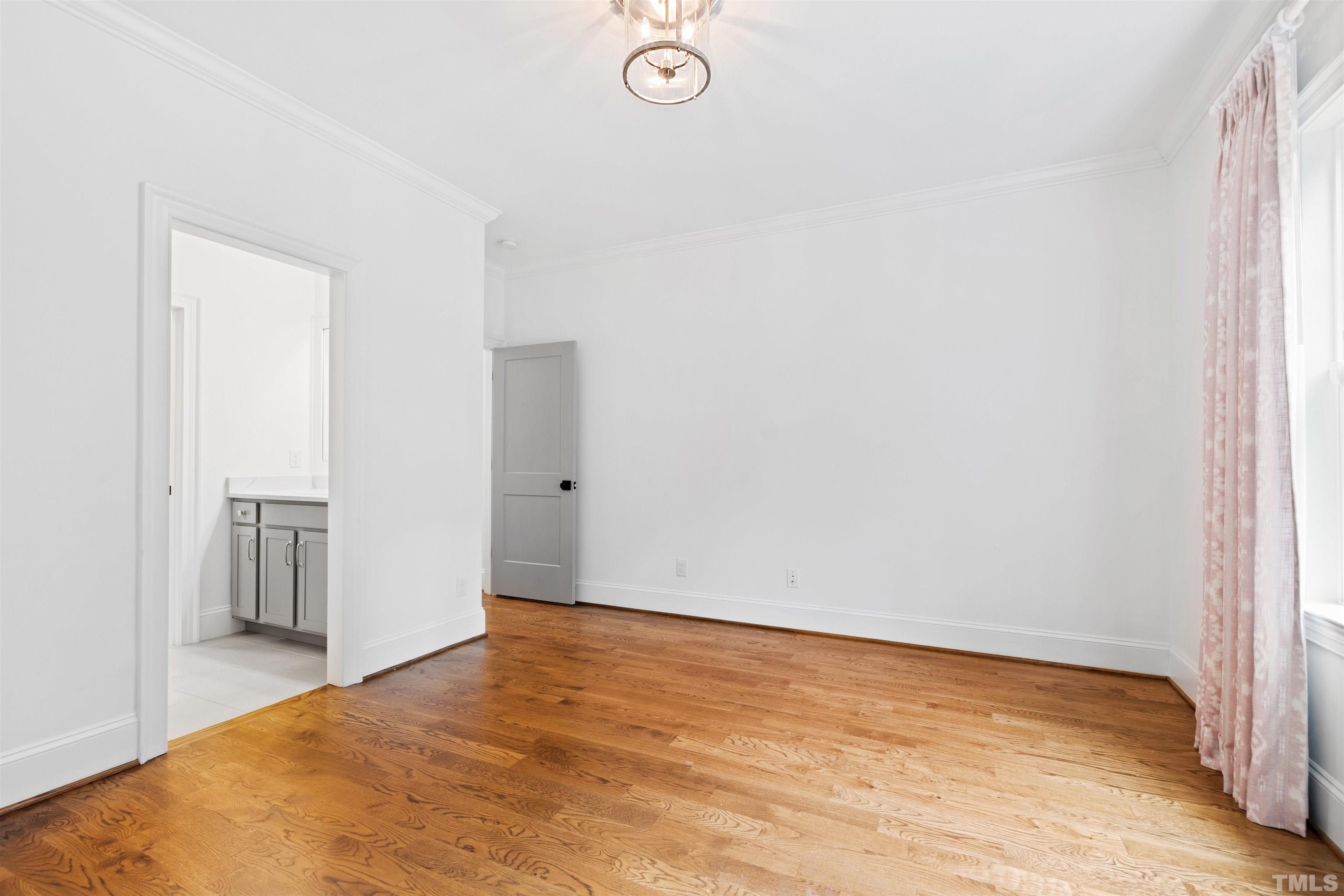 401 Latimer Road Raleigh, NC 27609 - Photo 28 of 45 a view of empty room with wooden floor