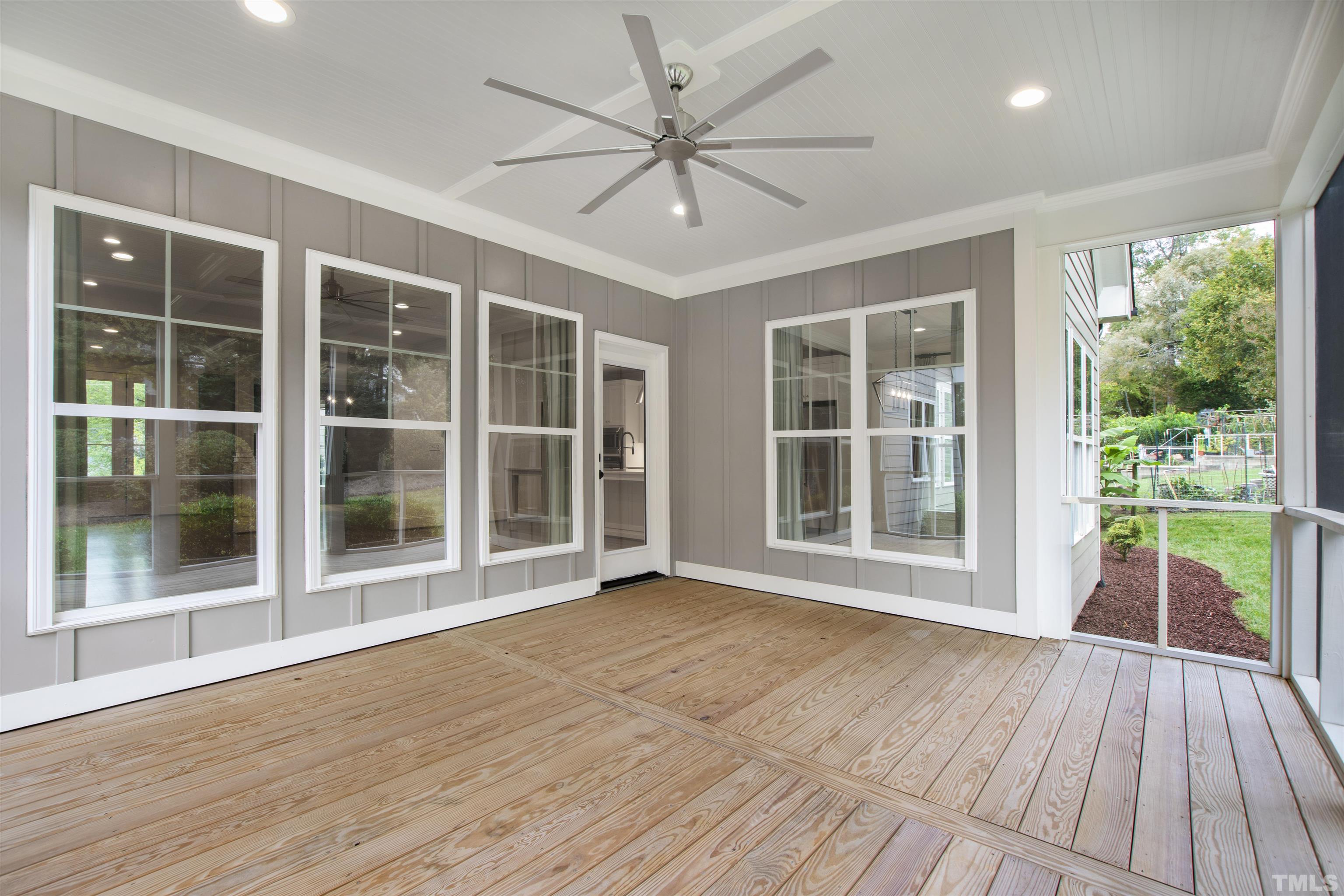 401 Latimer Road Raleigh, NC 27609 - Photo 30 of 45 a view of empty room with wooden floor and fan