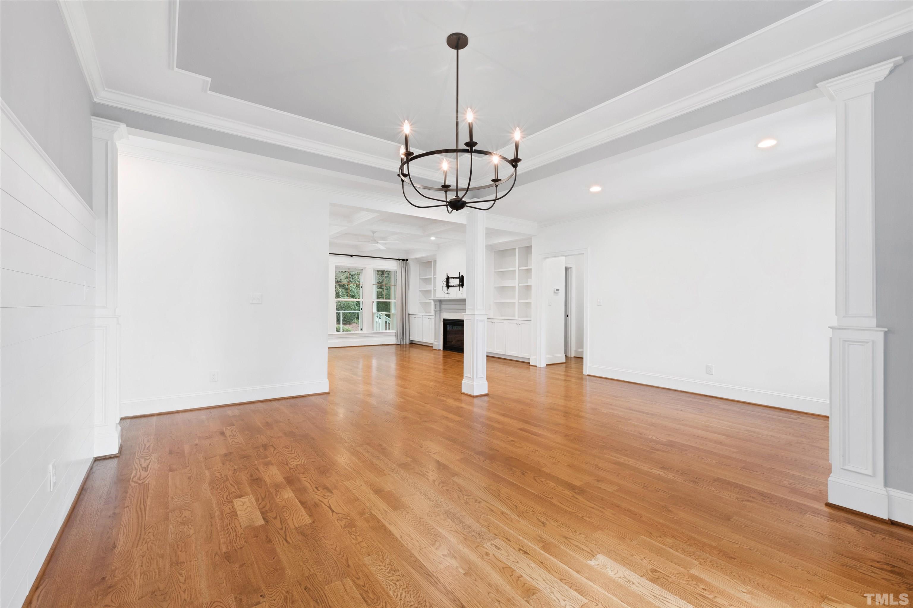 401 Latimer Road Raleigh, NC 27609 - Photo 35 of 45 a view of empty room with wooden floor ceiling fan and window