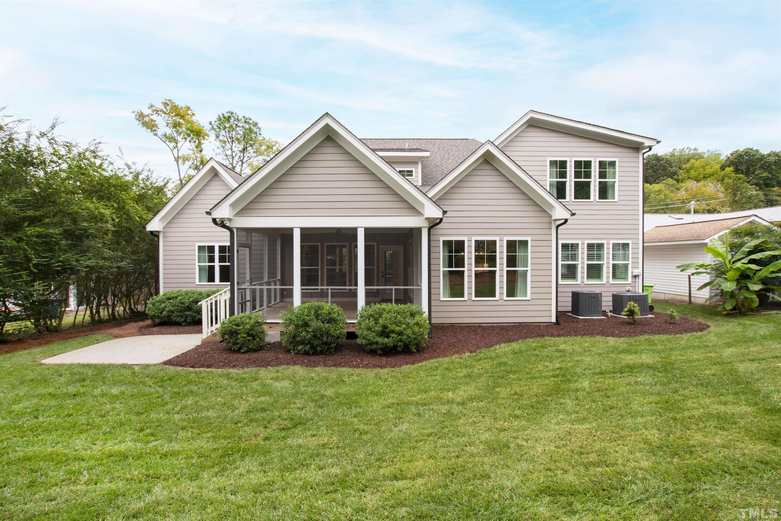 401 Latimer Road Raleigh, NC 27609 - Photo 41 of 45 a front view of a house with a garden and porch