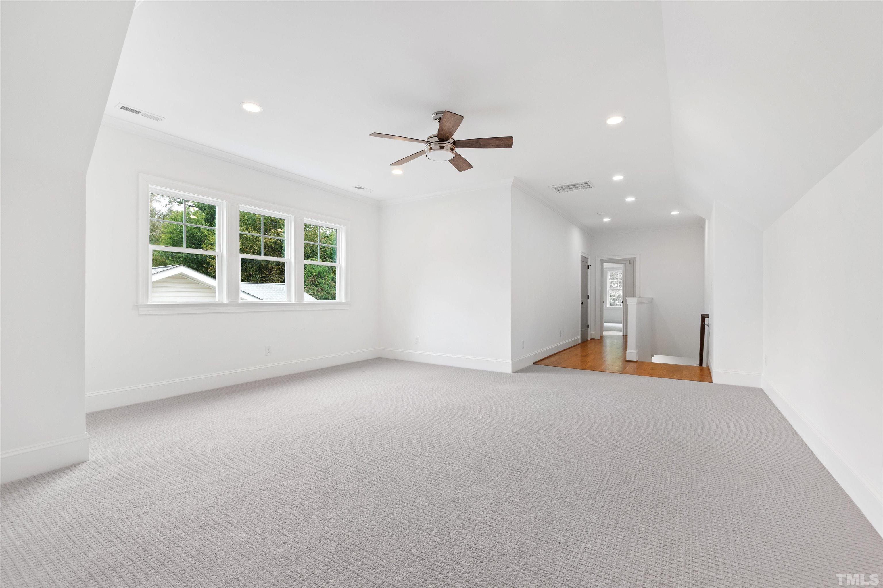 401 Latimer Road Raleigh, NC 27609 - Photo 44 of 45 an empty room with a window and a ceiling fan