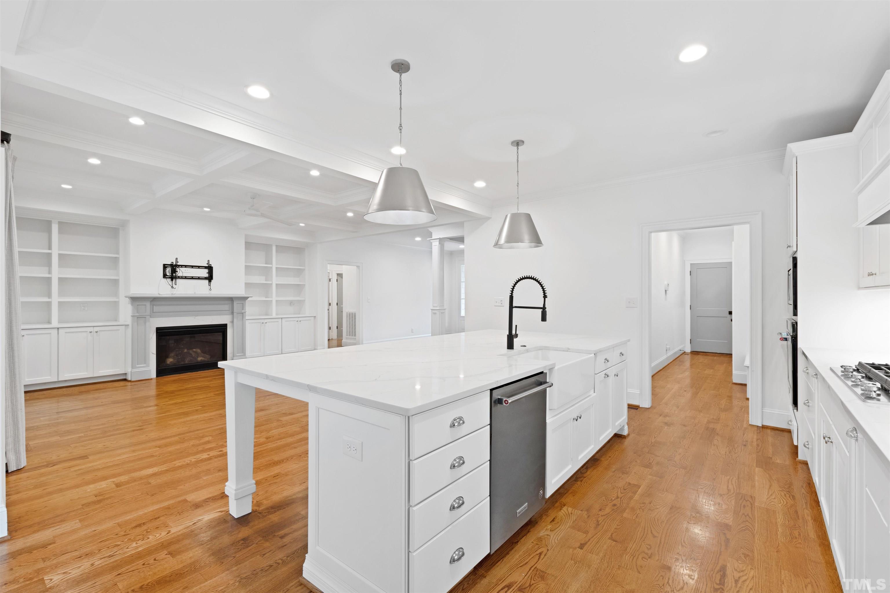 401 Latimer Road Raleigh, NC 27609 - Photo 7 of 45 a large white kitchen with a sink and dish washer