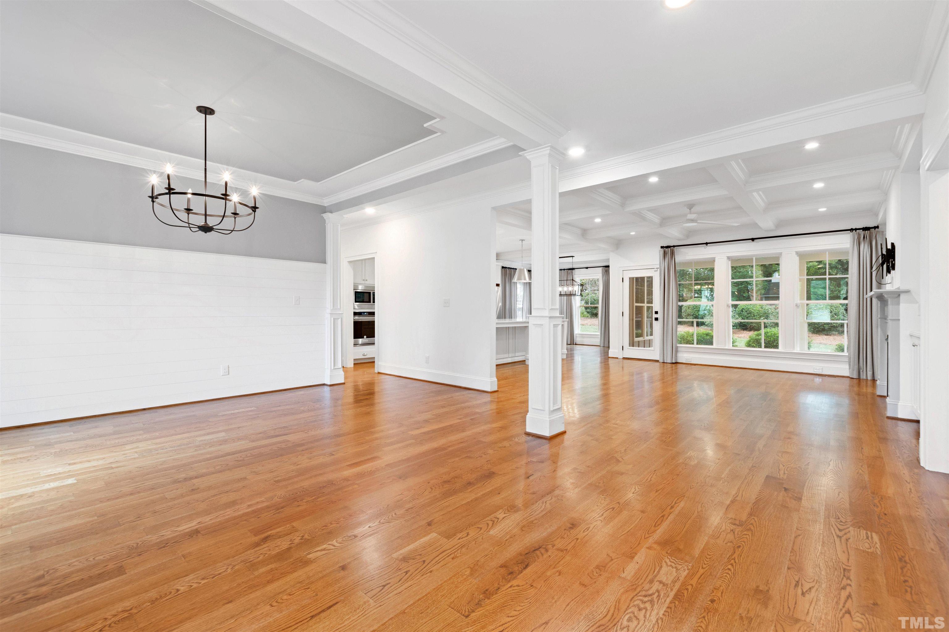 401 Latimer Road Raleigh, NC 27609 - Photo 9 of 45 a view of an empty room with wooden floor and a window
