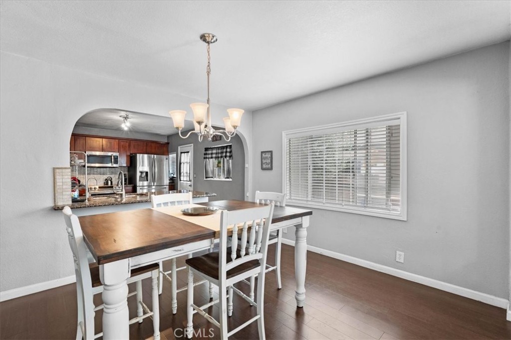 3974 5th Street Riverside, CA 92501 - Photo 13 of 45 a view of a dining room with furniture window and wooden floor