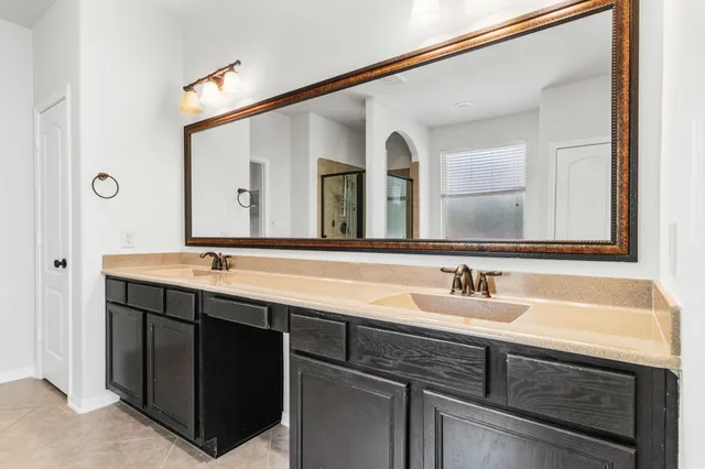 a bathroom with a sink and a mirror