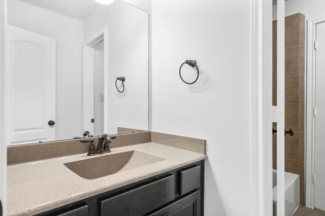 a bathroom with a white bath tub