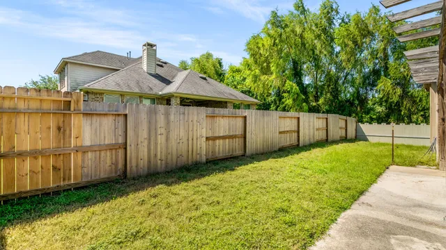 a view of a back yard of the house