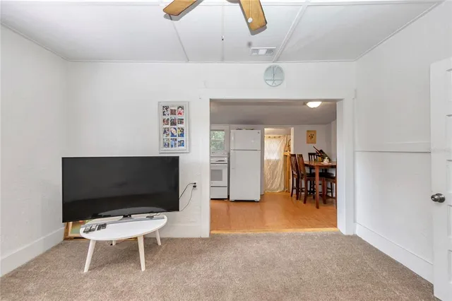 a kitchen with stainless steel appliances white cabinets and white appliances