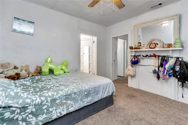 a bedroom with furniture and a window