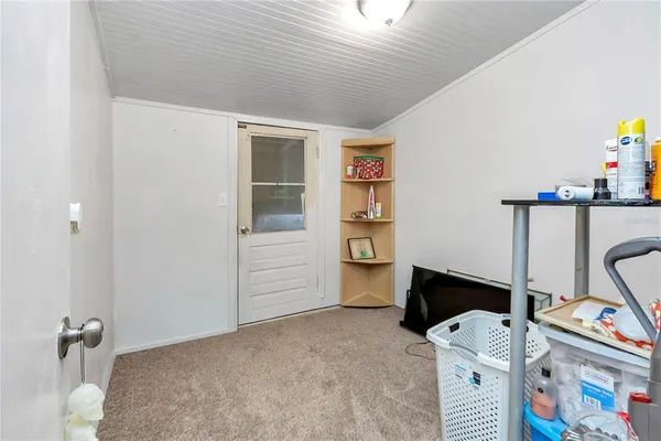 a view of a house with a yard and sitting area