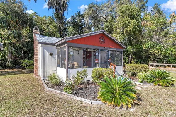 a kitchen with stainless steel appliances granite countertop a refrigerator and a stove