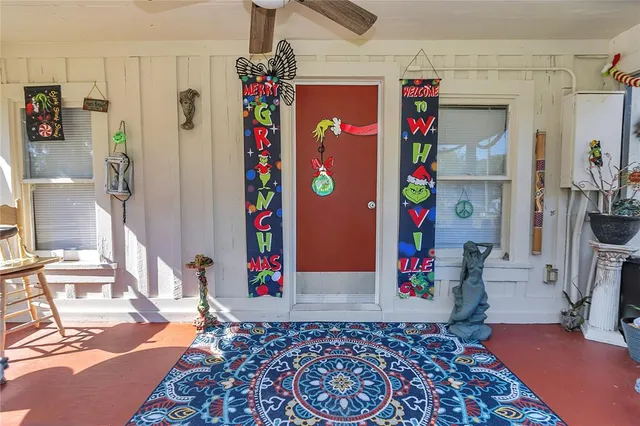 a kitchen with a stove a sink cabinets and a refrigerator