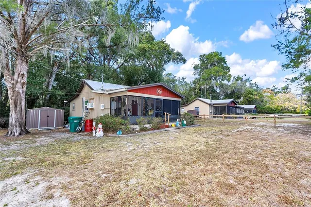 a front view of house with yard and seating area