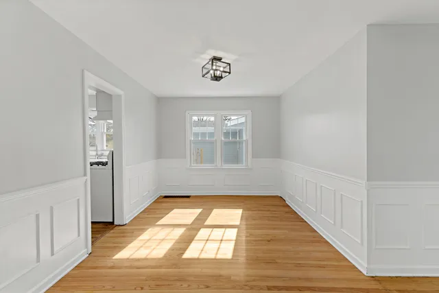 a view of a hallway with a window