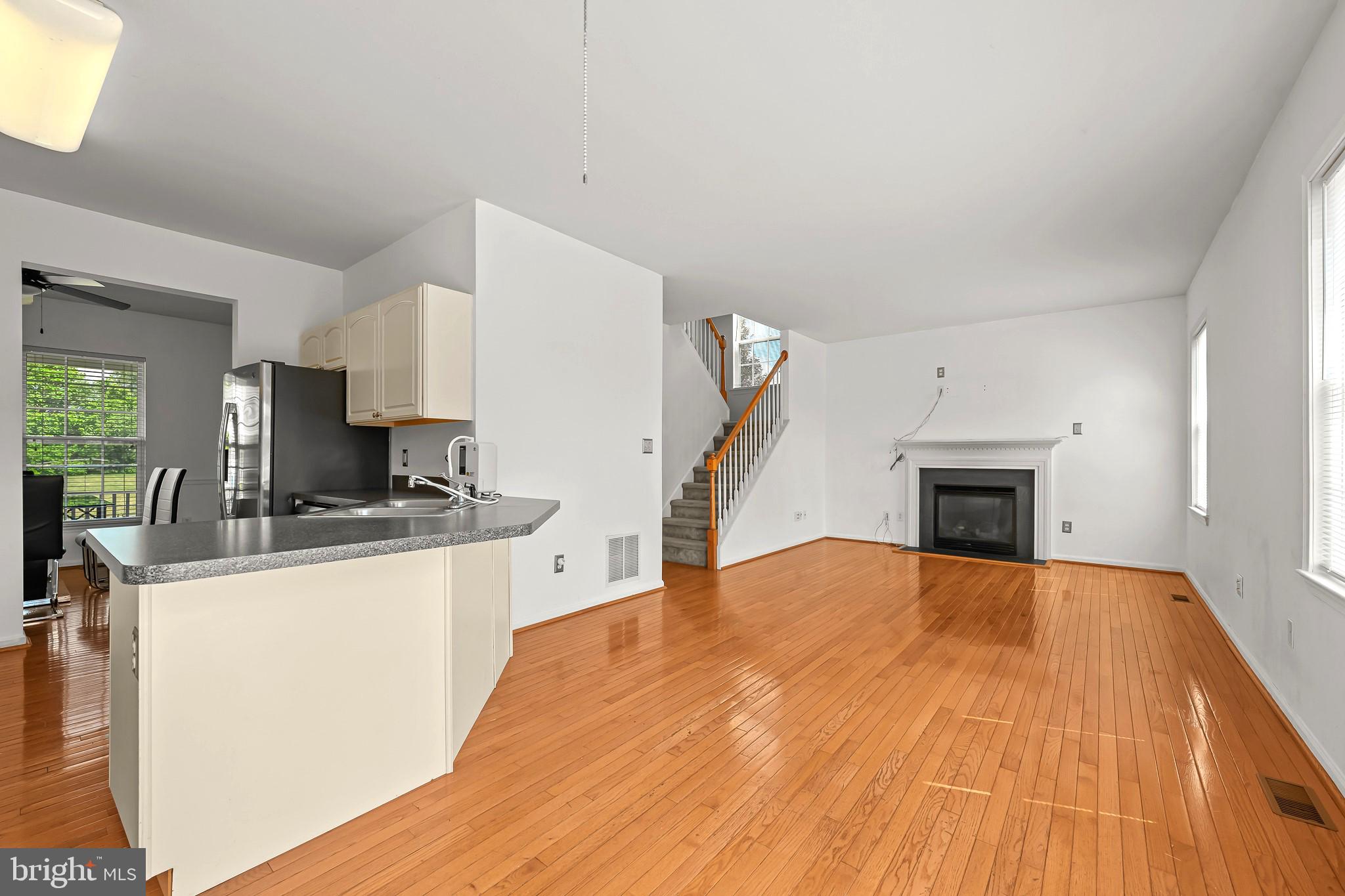 451 Carrington Drive Dover, DE 19904 - Photo 11 of 44 a large white kitchen with sink stove and refrigerator