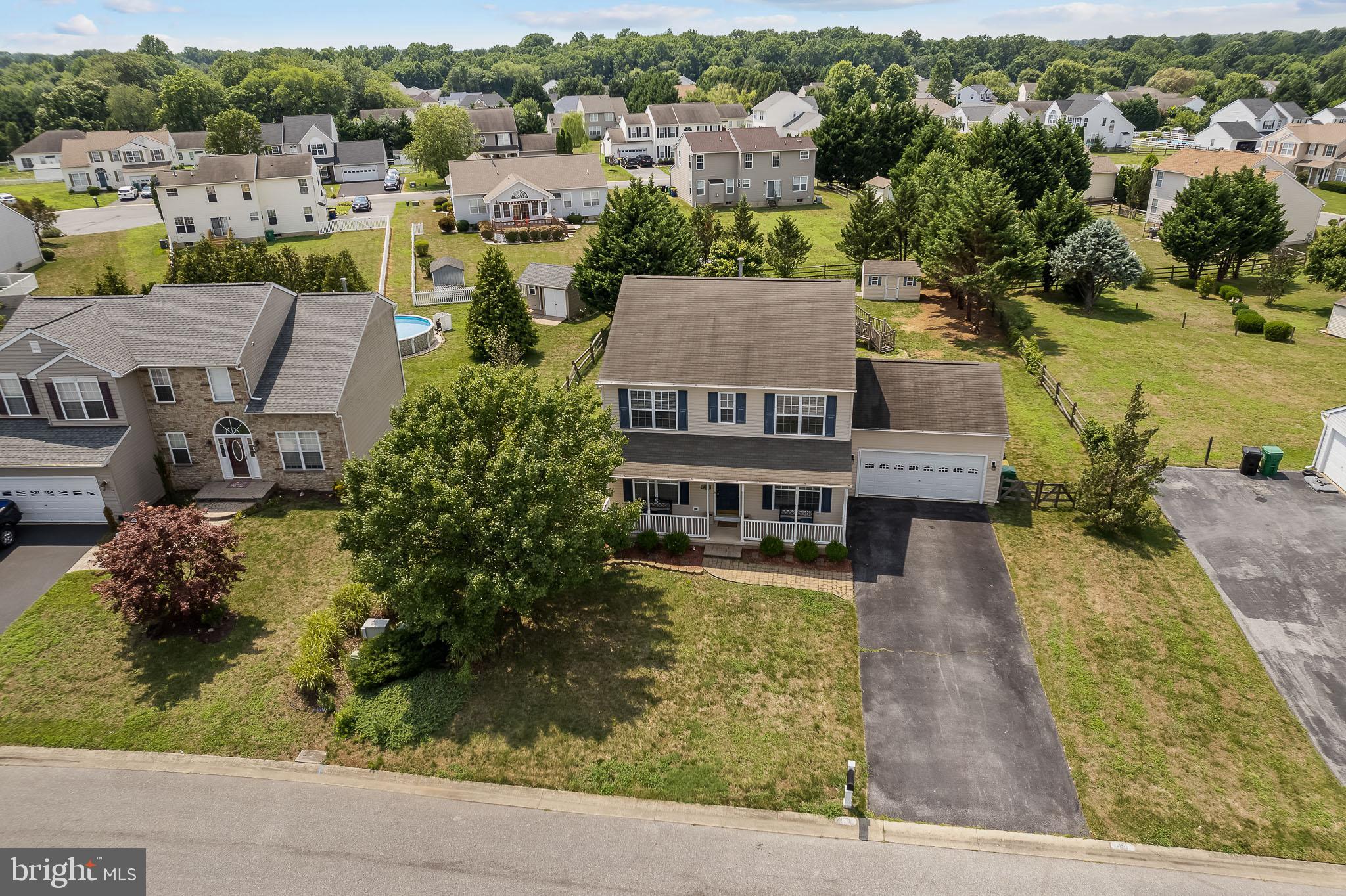 451 Carrington Drive Dover, DE 19904 - Photo 32 of 44 an aerial view of a house with a yard pool outdoor seating and lake view
