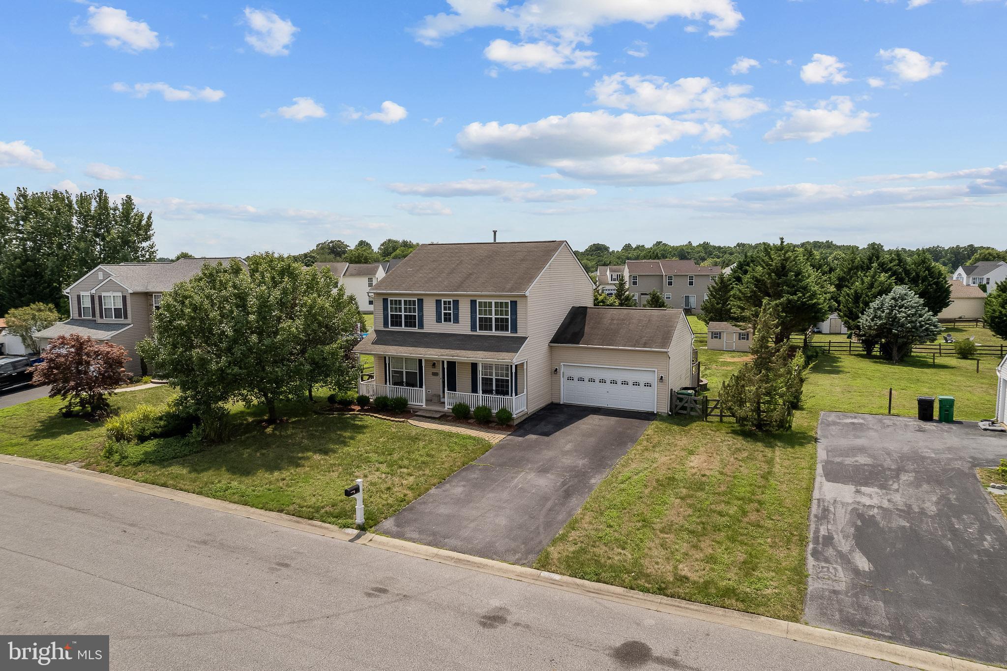451 Carrington Drive Dover, DE 19904 - Photo 34 of 44 an aerial view of a house with a garden and yard