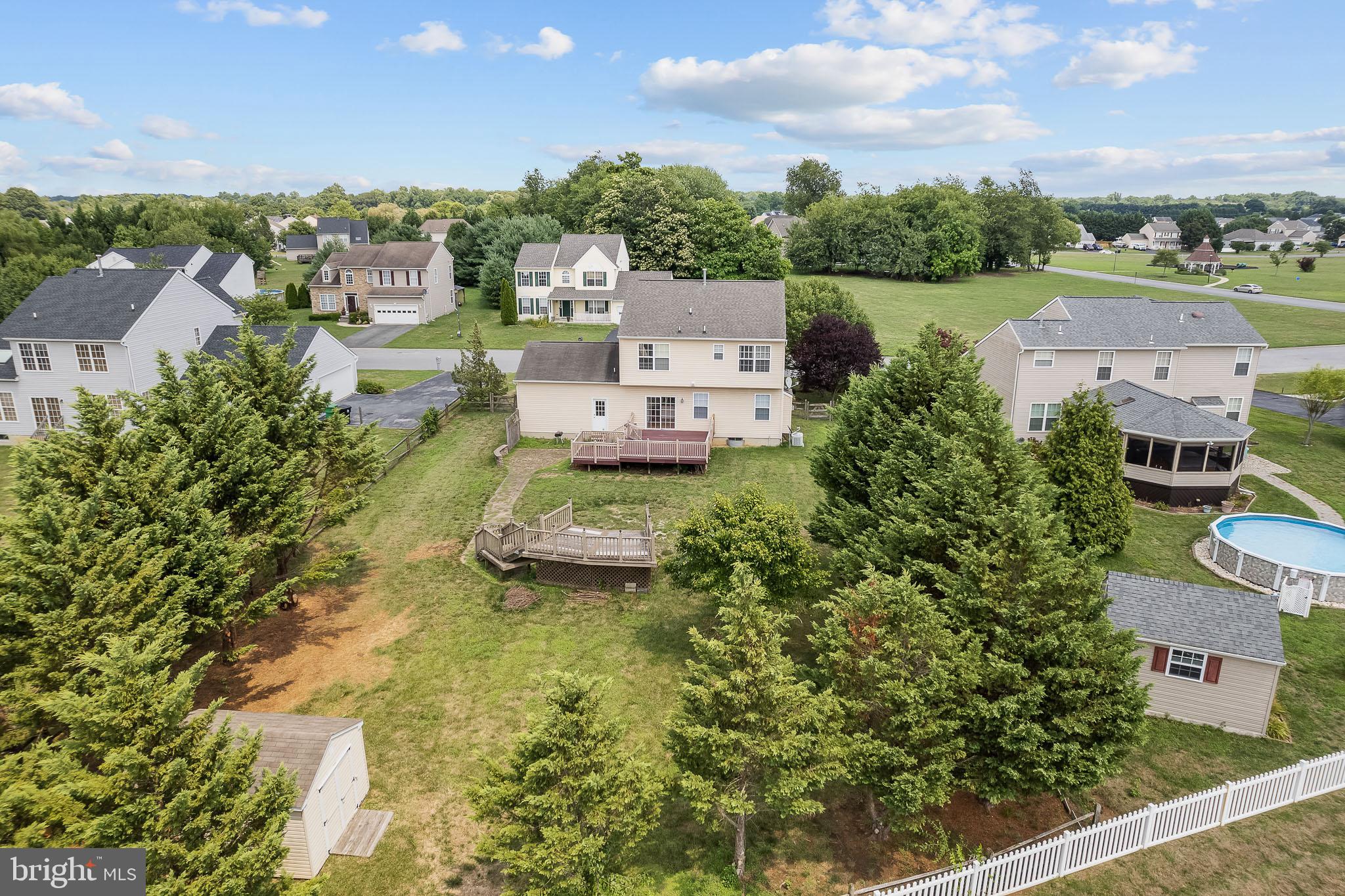 451 Carrington Drive Dover, DE 19904 - Photo 41 of 44 an aerial view of a house with a garden and lake view