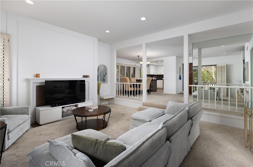 9 Flores Irvine, CA 92612 - Photo 11 of 38 a living room with furniture and a flat screen tv