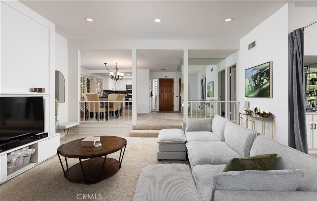 9 Flores Irvine, CA 92612 - Photo 13 of 38 a living room with furniture and a flat screen tv