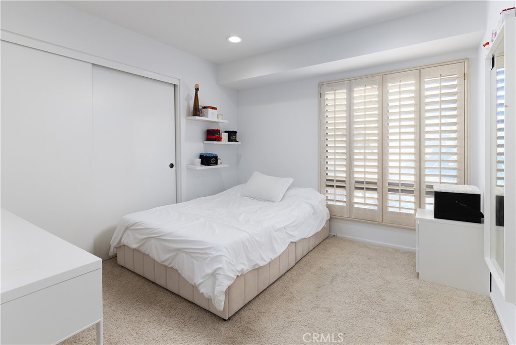 9 Flores Irvine, CA 92612 - Photo 23 of 38 a bedroom with a bed and a flat screen tv