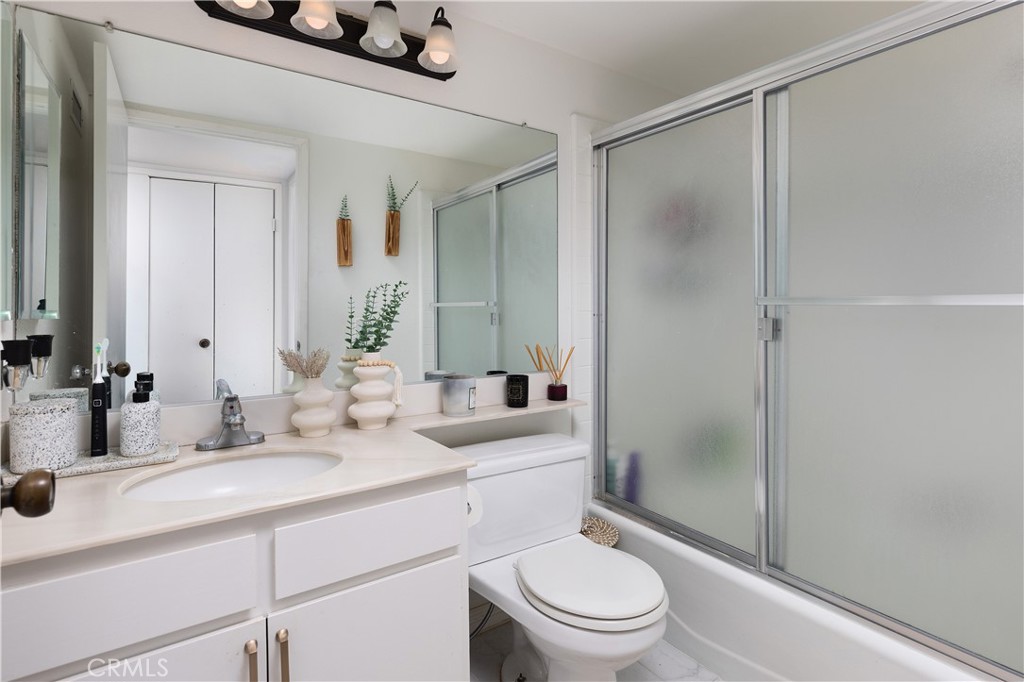 9 Flores Irvine, CA 92612 - Photo 26 of 38 a bathroom with a sink a toilet and shower